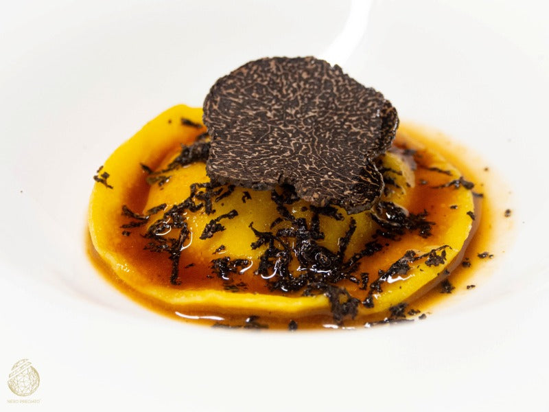Tuorlo in raviolo e Tartufo Nero Pregiato